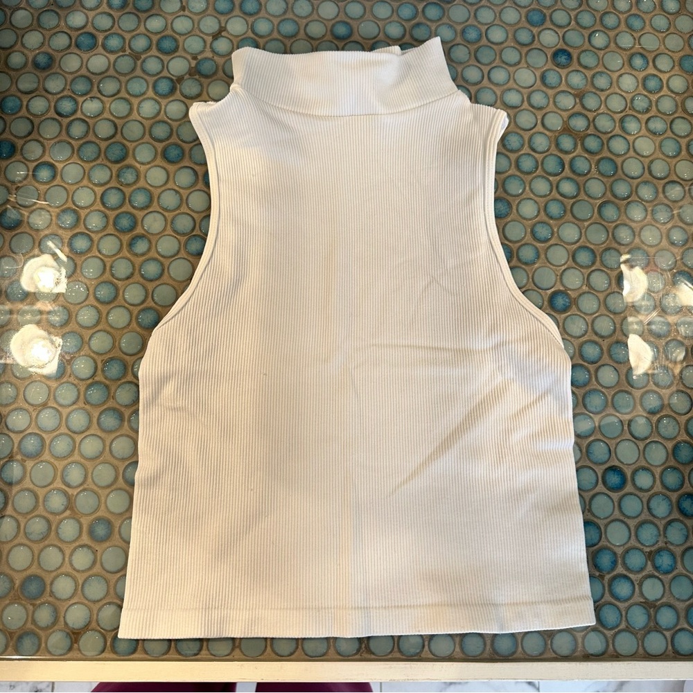 Dynamic Sleeveless White Turtleneck Top